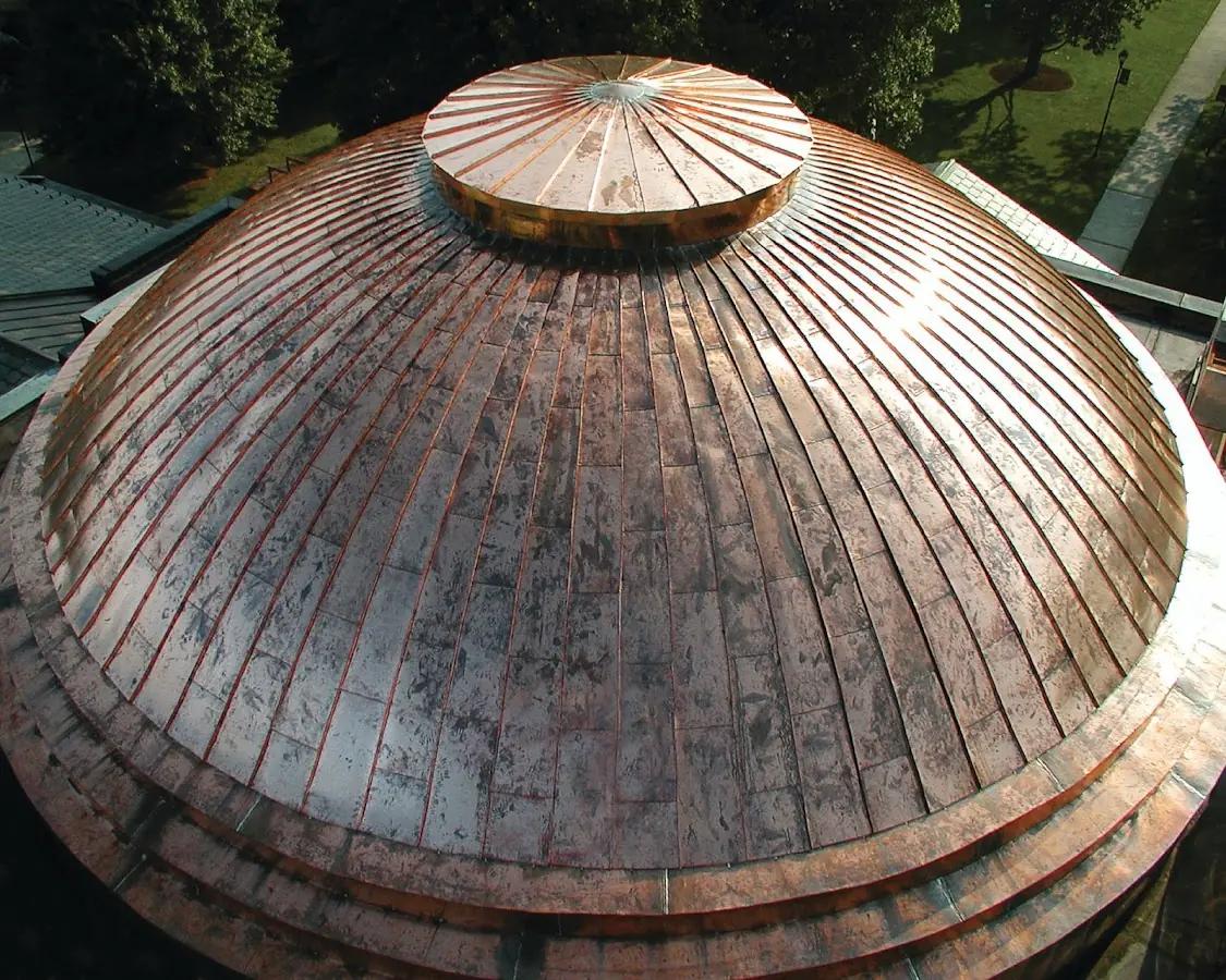 Craftsman Roofing crew installing a new roof in Clinton